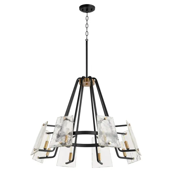 The Tioga 8-Light Chandelier combines nostalgic mid-century modern aesthetics with contemporary minimalist design. Featuring geometric framing, frosted glass trapezoid shades, and a striking noir finish with aged brass accents, this fixture creates a sophisticated focal point with free-floating illumination.