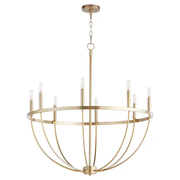 The Tribute chandelier combines timeless design with contemporary sensibility through its linear frame and clear glass shades. The aged brass finish adds warmth while maintaining versatility for both indoor and outdoor applications.