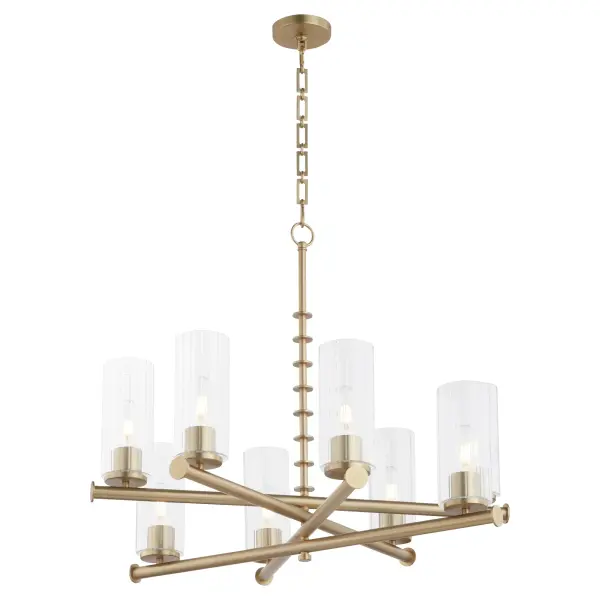The Mercier chandelier brings French chateau sophistication with its distinctive layered arm design and aged brass finish. Eight candelabra lights housed in slender clear glass shades create dimensional beauty from every angle. - alternate view