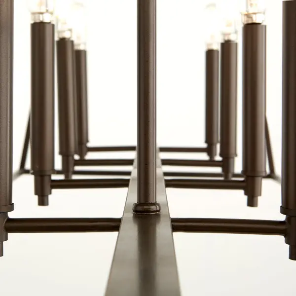 The Gabriel 10-light linear pendant delivers minimal design with maximum versatility. Its Oiled Bronze finish and included candle sleeves in three finishes (Noir, Satin Nickel, Aged Brass) allow customization to match any aesthetic. - alternate view