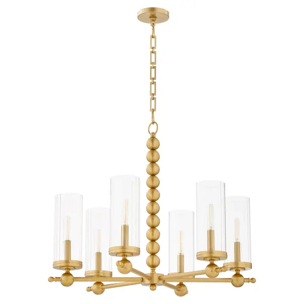 The Lee Boulevard chandelier blends traditional wagon wheel design with contemporary spherical details and modern beaded elements. Clear fluted glass shades and aged brass finish create a luxurious yet comfortable aesthetic.