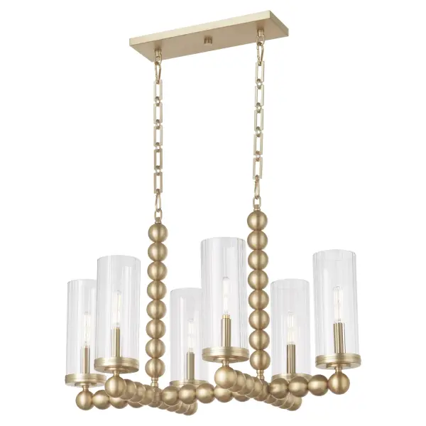 The Lee Boulevard linear chandelier blends traditional warmth with contemporary spherical details and fluted glass shades. Inspired by a Kansas City countryside home, this 6-light fixture offers luxurious transitional style in aged brass. - alternate view