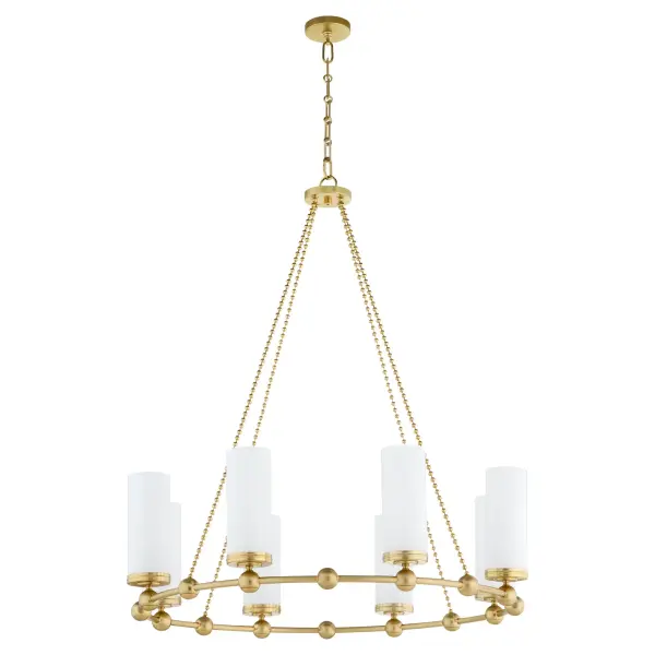 The Lee Boulevard chandelier blends traditional elegance with contemporary spherical accents and vertically-fluted white glass shades. Inspired by a Kansas City countryside home, this 8-light fixture in aged brass offers transitional comfort with luxurious appeal.