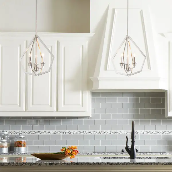 The Knox pendant combines clean geometric lines with a sophisticated satin nickel finish, creating a striking focal point for transitional spaces. Its open pentagonal frame design and adjustable hanging height make it adaptable to various ceiling heights and room configurations. - alternate view