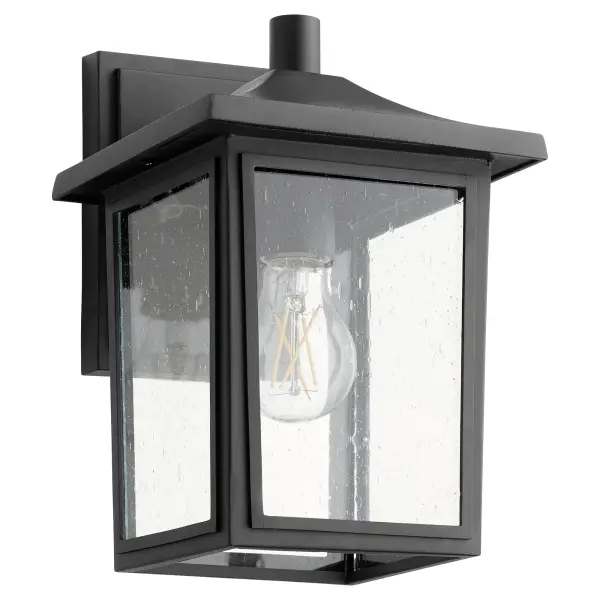 This 11-inch outdoor wall light combines timeless design with practical functionality. The noir black finish and clear seeded glass create warm ambient lighting perfect for covered outdoor spaces.