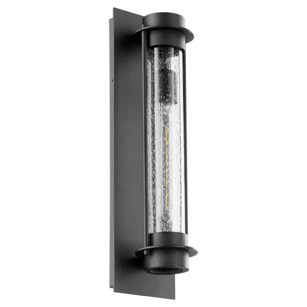 The Roope wall lantern delivers contemporary style with its tall, minimalist form and clear-seeded glass diffuser. Engineered for maximum light output, it's perfect for covered patios and modern entryways.