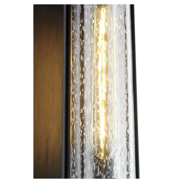 The Roope wall lantern delivers contemporary style with its tall, minimalist form and clear-seeded glass diffuser. Engineered for maximum light output, it's perfect for covered patios and modern entryways. - alternate view