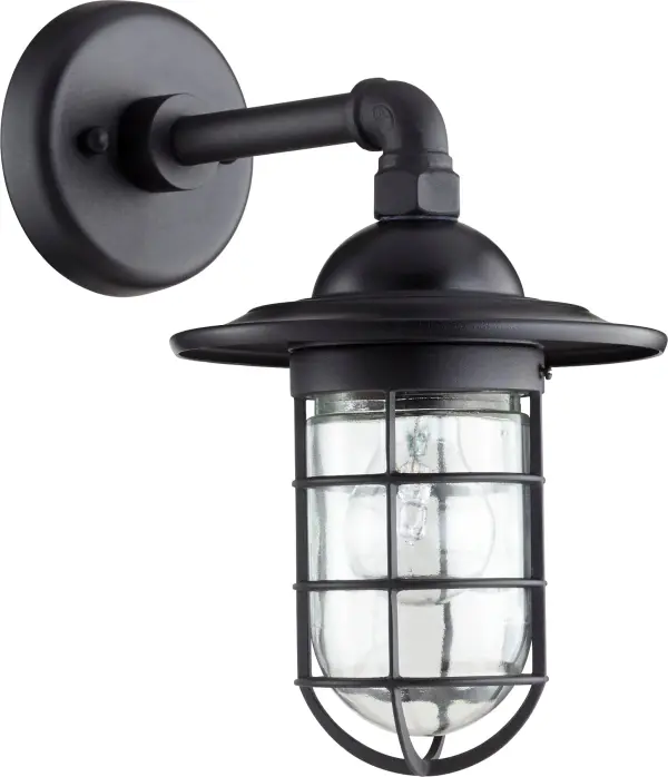 The Bowery 12" wall light combines coastal style with practical outdoor lighting. Its caged glass design and black finish create a nautical aesthetic perfect for entryways, patios, and garage doors.