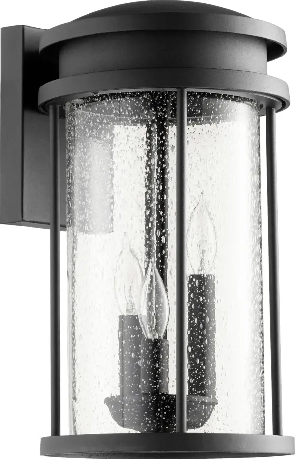 The Hadley outdoor wall light combines clean contemporary lines with practical durability. Its elongated drum silhouette and seeded glass create beautiful ambient lighting while the wet-rated construction ensures reliable performance in any weather.