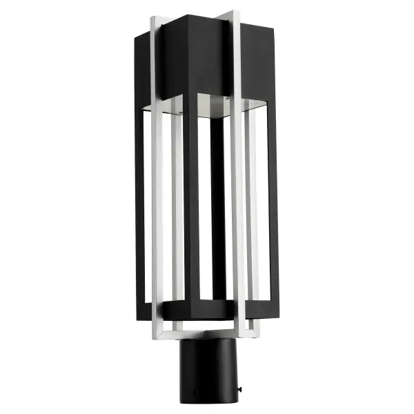 The Al Fresco post light features a distinctive dual-layered geometric frame with sophisticated Noir finish. Its modern symmetry and clean lines make it ideal for contemporary outdoor settings seeking architectural interest.