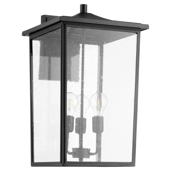 The Riverside outdoor wall lantern combines timeless design with modern functionality. Featuring a noir black finish and clear seeded glass panels, this wet-rated fixture delivers both style and durability for covered outdoor spaces.