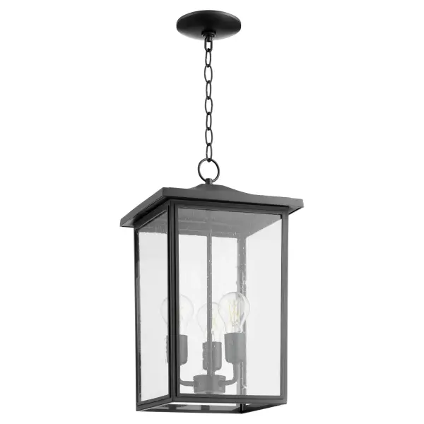 The Riverside pendant brings timeless elegance to covered outdoor spaces with its noir black finish and clear seeded glass panels. Three-light design provides ample illumination while the classic lantern silhouette complements both traditional and transitional architecture.