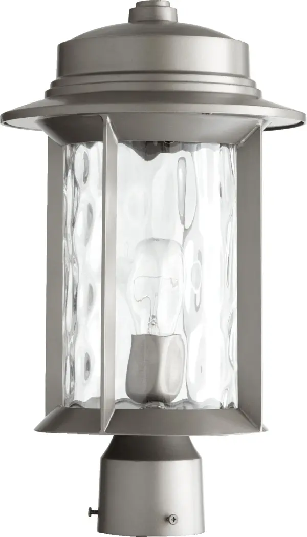 The Charter Graphite post light combines clean-lined design with decorative hammered glass panels, creating a sophisticated outdoor lighting solution. Its durable metal construction and transitional style make it versatile for various architectural settings.