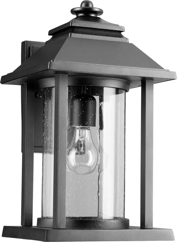 The Crusoe outdoor wall light combines traditional design with nautical influences in a compact 9-inch profile. Its cast metal frame and clear glass cylinder deliver classic sophistication while maintaining durability in harsh weather conditions.