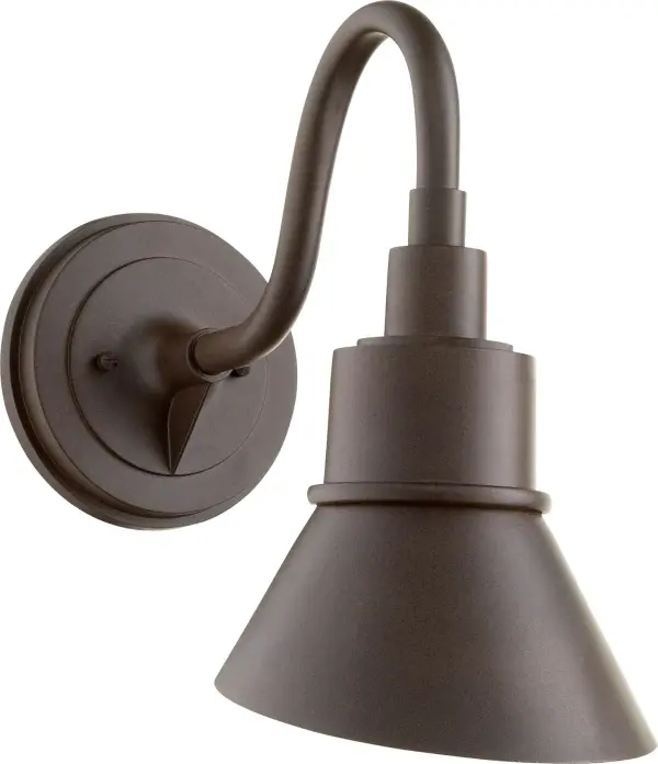 The Torrey wall light combines industrial and rustic design elements with a curved arm and hood shade. Its Wet rating makes it ideal for outdoor applications while maintaining indoor versatility.