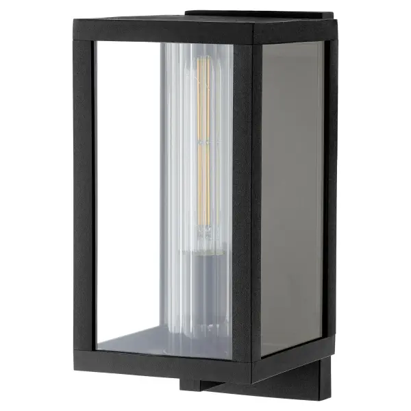The Parks 12" wall lantern combines modern design with marine-grade durability, featuring a boxed silhouette in noir finish with clear fluted glass. Dimmable LED lighting provides efficient illumination for covered outdoor spaces.