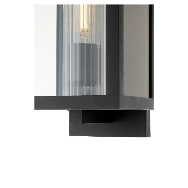 The Parks 12" wall lantern combines modern design with marine-grade durability, featuring a boxed silhouette in noir finish with clear fluted glass. Dimmable LED lighting provides efficient illumination for covered outdoor spaces. - alternate view