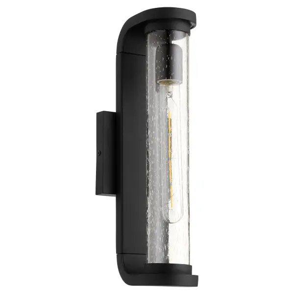 The Vitro wall lantern combines contemporary minimalist design with maximum light output. Its tall, curved form and clear-seeded glass diffuser create a striking accent for modern outdoor spaces while providing excellent illumination.