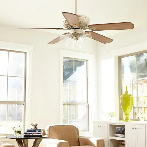 The Chateaux combines timeless traditional styling with practical functionality. Featuring scalloped tip blades, floral blade arms, and three seeded glass light shades, this 52" fan delivers both visual charm and reliable air circulation. - alternate view