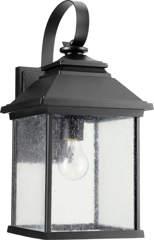 The Pearson outdoor wall lantern combines timeless traditional design with modern durability. Featuring an aluminum frame in a sophisticated black finish and clear seeded glass panels, this fixture delivers both style and function for outdoor spaces.