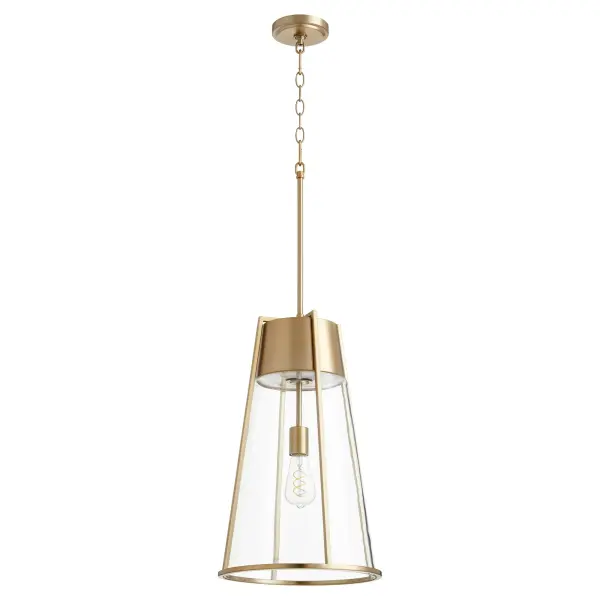 This sleek single-light pendant seamlessly blends industrial charm with transitional sophistication. The aged brass conical shade paired with clear glass creates visual interest while the noir chain adds modern edge.