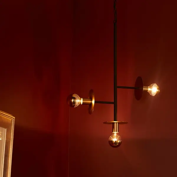 The Voyager pendant combines minimalist design with industrial edge through its shade-less, multi-directional light sources and striking two-tone finish. Perfect for showcasing decorative bulbs while delivering functional illumination. - alternate view