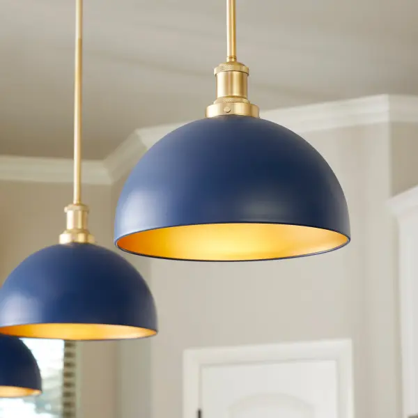 This distinctive cone pendant combines nostalgic charm with industrial edge through its opaque blue exterior and aged brass interior. The decorative cast fitter and matching chain system create visual interest perfect for kitchen islands or hallways. - alternate view