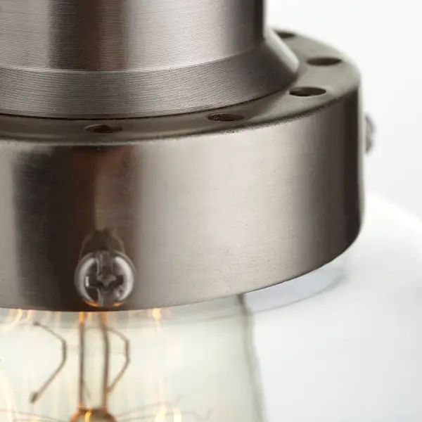This satin nickel mini pendant combines timeless style with practical versatility. Its clear glass shade and sleek finish work seamlessly in kitchens, bathrooms, and hallways, while the adjustable rod system accommodates various ceiling types. - alternate view
