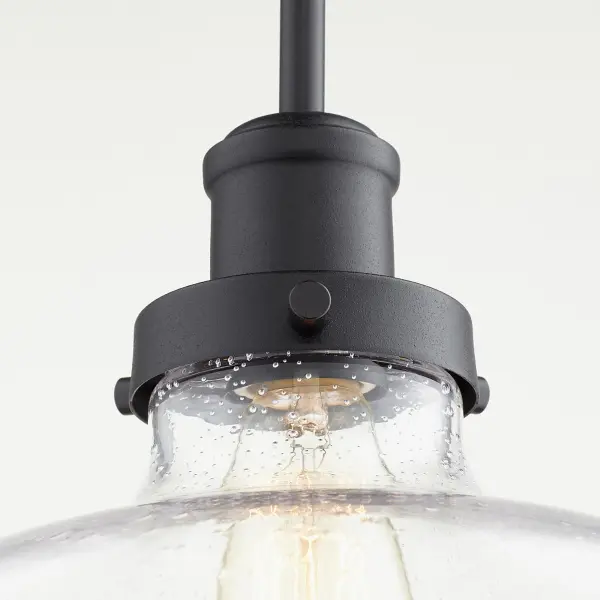 This elegant pendant combines clear seeded glass with a bold black finish, creating a versatile fixture that bridges traditional and contemporary styles. Perfect for kitchens and dining areas. - alternate view