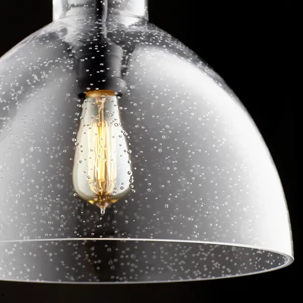 This elegant dome pendant combines clear seeded glass texture with black hardware for timeless appeal. The adjustable chain allows customization, while the exposed bulb design adds industrial character. Perfect for kitchens, dining areas, and entryways. - alternate view