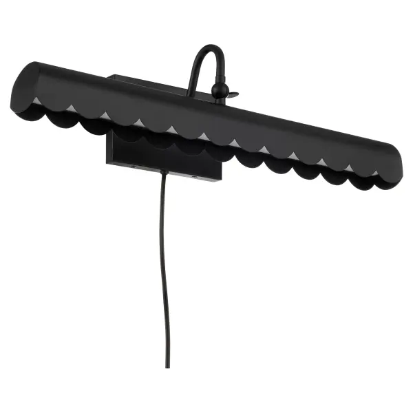 The Karnes picture light from Tamara Day's collection combines timeless elegance with practical functionality. Its distinctive scalloped edge design and adjustable neck allow precise light positioning for artwork.