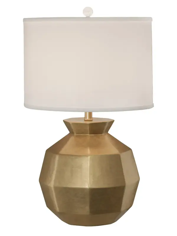 The Gem table lamp combines artisanal ceramic craftsmanship with a layered gold lacquer finish that adds warmth and sophistication to any space. The white silk hardback shade provides soft, diffused light perfect for ambient illumination.