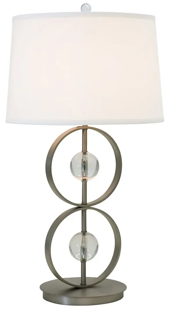 The Lake Shore table lamp combines refined metal craftsmanship with decorative glass accents and a classic linen shade. Its satin pewter finish and 28-inch height make it versatile for both residential and hospitality settings.