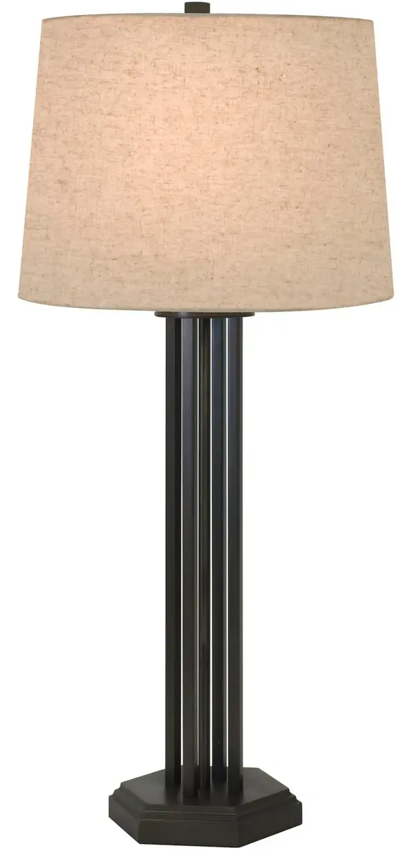 The Woodland table lamp combines a rich Mahogany Bronze metal base with a natural linen hardback shade, creating sophisticated ambient lighting. At 33 inches tall, it makes a substantial statement while the neutral palette adapts to various décor styles.