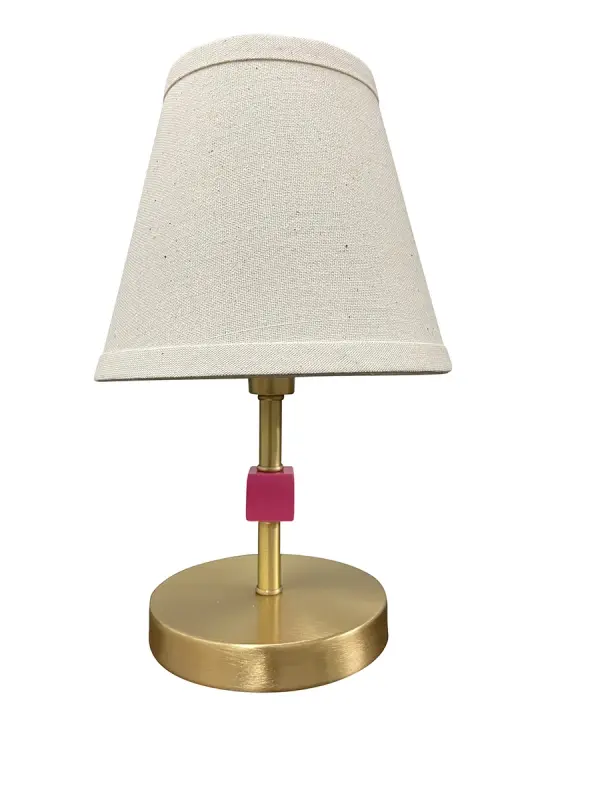 The Bryson Mini brings sophisticated accent lighting to compact spaces. Its satin brass finish and orchid accent create a refined look, while the petite 12-inch height makes it perfect for nightstands and small tables.