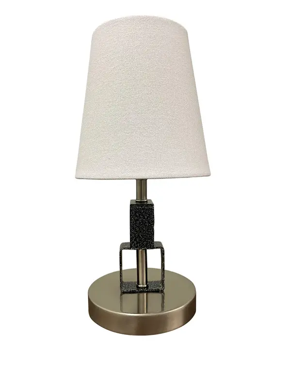 The Bryson Mini delivers sophisticated style in a compact 12.75" profile. Its satin nickel finish and linen shade create warm, inviting light ideal for bedside tables, desks, or accent surfaces.