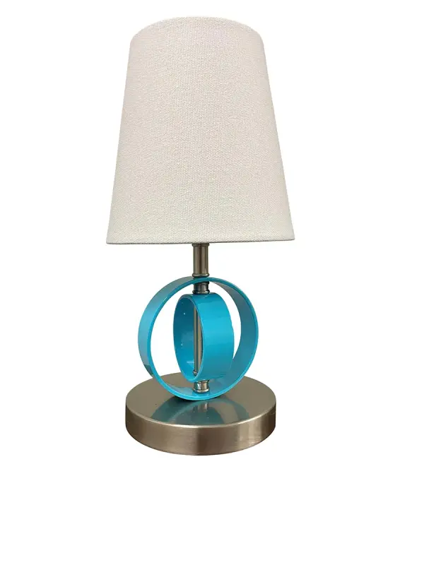 The Bryson Mini brings sophisticated style to small spaces with its unique double ring metal base and azure accent detail. At just 12.5 inches tall, this compact lamp delivers focused task lighting with transitional appeal.