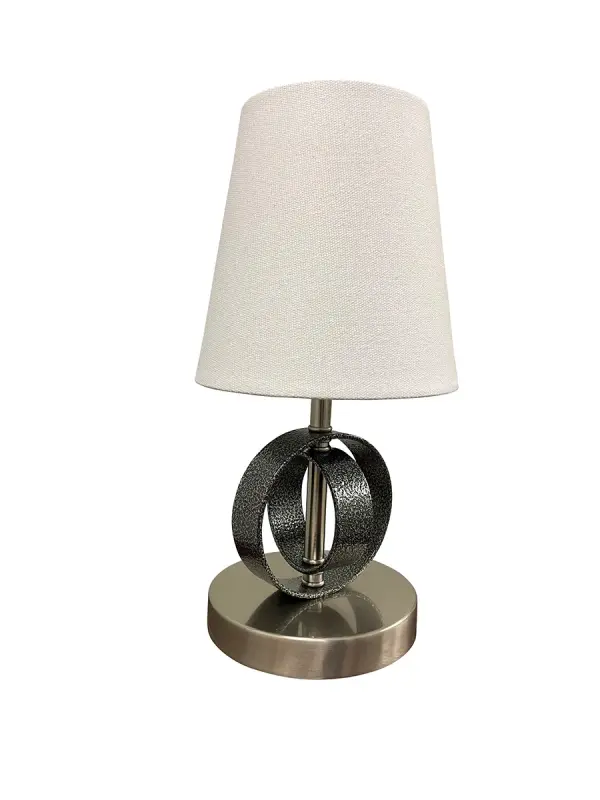 The Bryson Mini combines refined metalwork with a classic white linen shade in a compact 12.5" profile. Its dual-tone Supreme Silver and Satin Nickel finish adds dimensional interest while maintaining versatility across décor styles.