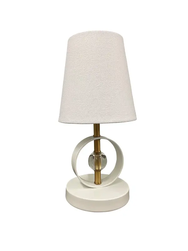 The Bryson Mini combines sophisticated crystal accents with weathered brass in a compact 12.5" design. Perfect for adding ambient lighting and decorative charm to small spaces without overwhelming surfaces.