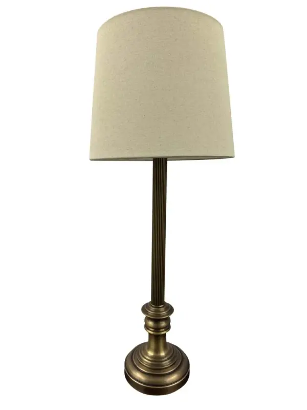 The Bristol table lamp combines traditional elegance with practical functionality. Its 30-inch height and antique brass finish make it a versatile choice for various room settings, from bedrooms to home offices.