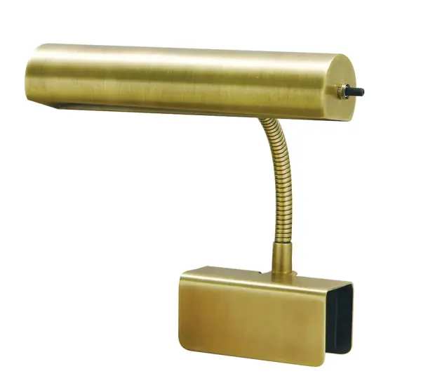 The Advent Bed Clamp Lamp offers traditional styling with practical functionality. Its adjustable clamp base secures to headboards or nightstands, providing focused task lighting without occupying surface space.