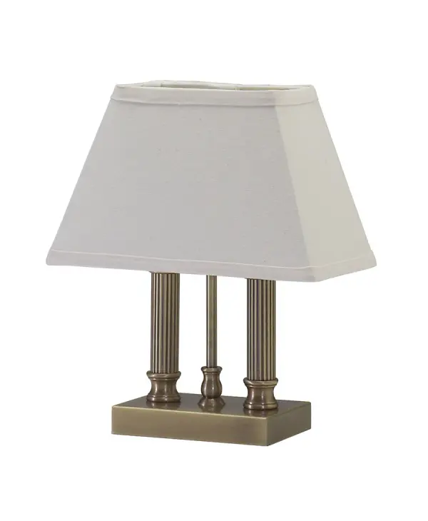 The Coach Mini Lamp delivers classic styling in a space-efficient 12.5" height. Its antique brass finish and linen shade create warm ambient lighting perfect for intimate spaces and accent applications.