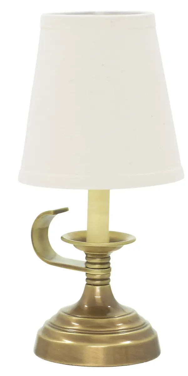 The Coach Mini Lamp delivers traditional elegance in a compact 12-inch profile. Its antique brass finish and linen shade create warm ambient lighting perfect for intimate spaces and accent applications.