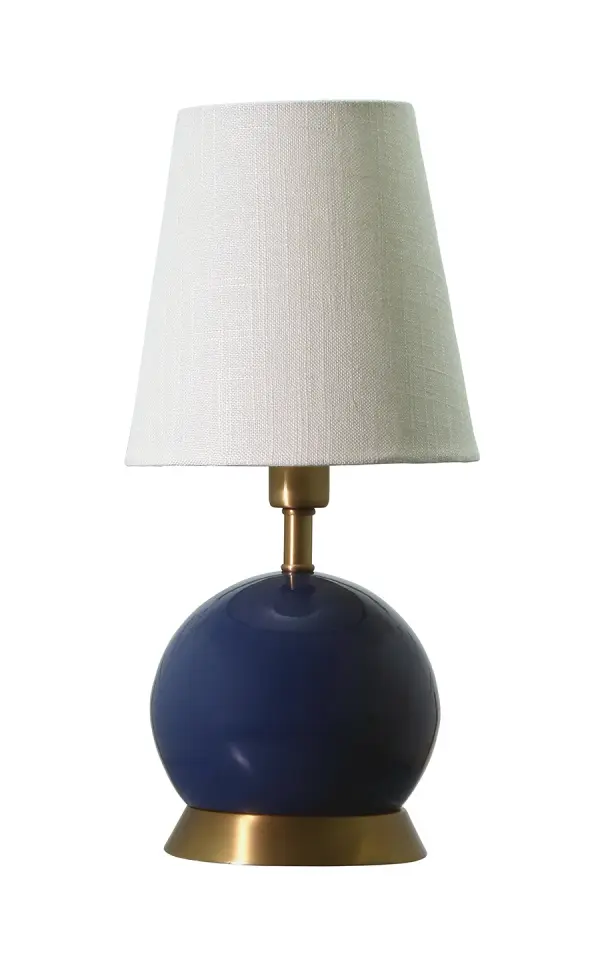 The Geo Ball Mini Accent Lamp brings contemporary geometric design to small spaces with its 12-inch spherical form. Navy blue finish with weathered brass accents creates visual interest, while the compact footprint makes it perfect for nightstands and side tables.
