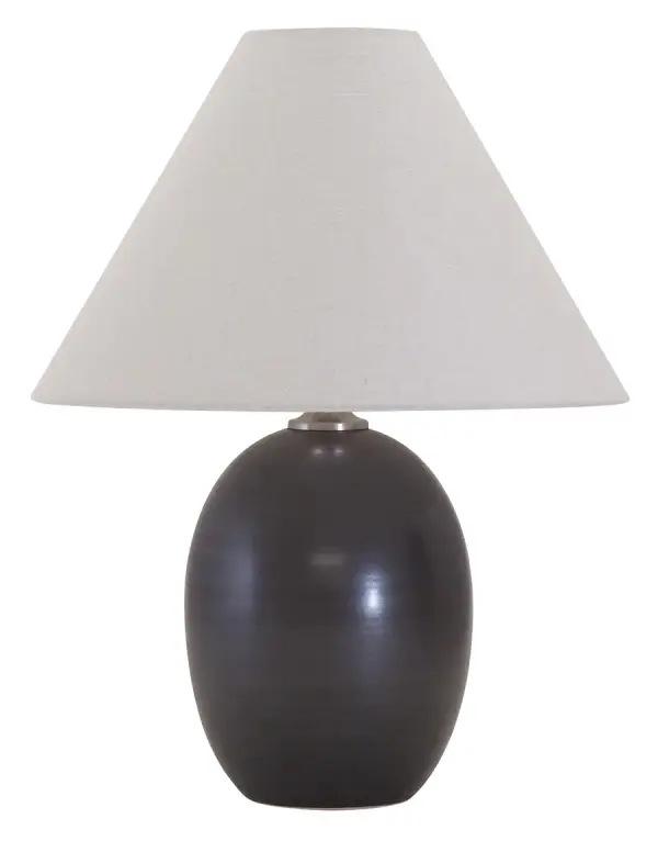 The Scatchard table lamp combines traditional ceramic craftsmanship with a modern matte black finish. At 22.5" tall with a generous 17" cream linen shade, it provides substantial lighting and visual presence for any room.
