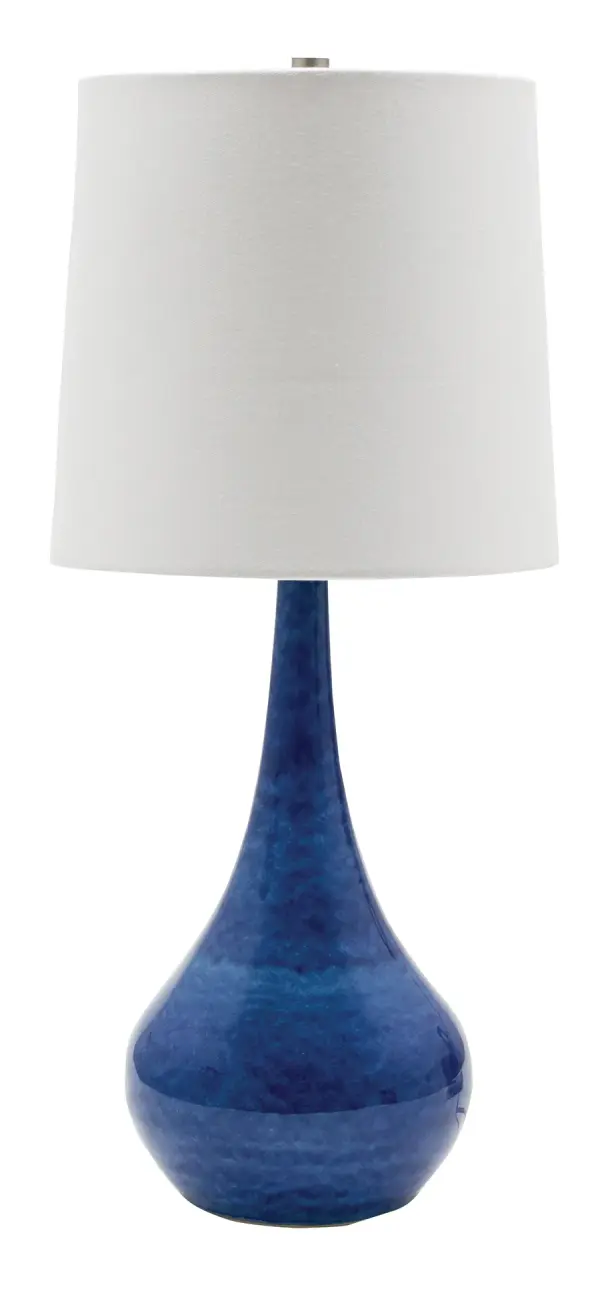 The Scatchard table lamp combines timeless stoneware craftsmanship with a striking blue gloss finish. At 22.5 inches tall, it provides substantial presence while the white linen shade softens the light beautifully.