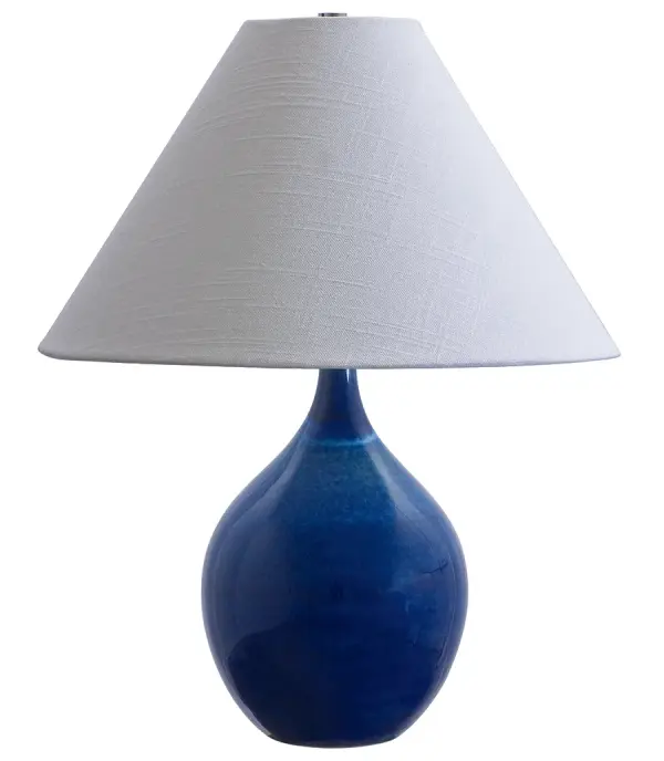 The Scatchard table lamp combines timeless ceramic craftsmanship with a vibrant blue gloss finish. Its 19-inch height and cream linen shade create warm, ambient lighting perfect for traditional and coastal-inspired interiors.