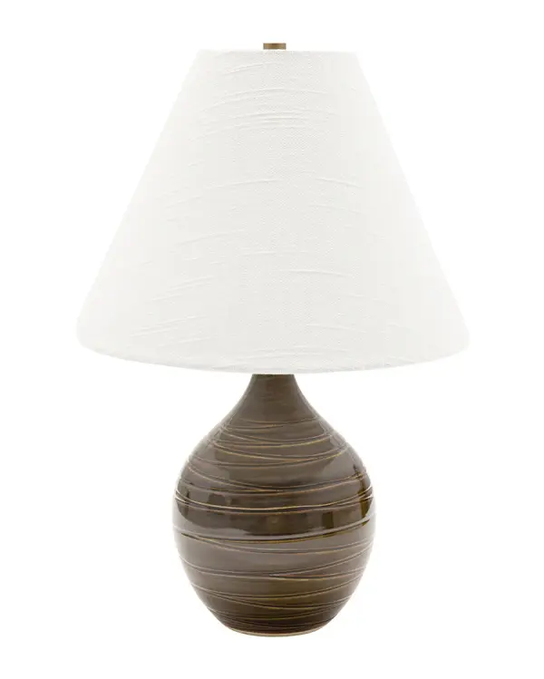 The Scatchard table lamp combines handcrafted ceramic artistry with functional lighting. Its scored brown gloss finish and organic form bring warmth and texture to any space, while the cream linen shade provides soft, ambient light.