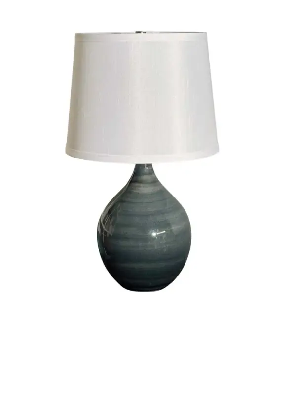 The Scatchard table lamp combines artisanal ceramic craftsmanship with transitional styling. Its 18.5" height and neutral slate finish make it versatile for residential and hospitality settings, while the white linen shade provides warm, diffused light.