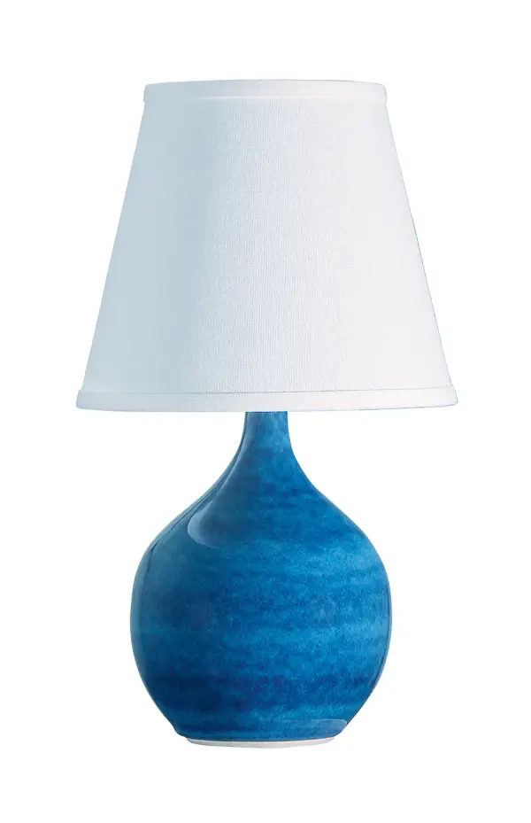The Scatchard mini accent lamp brings a pop of color and artisanal charm to any space. Its glossy blue ceramic base paired with a crisp white linen shade creates a fresh, coastal aesthetic perfect for bedrooms, offices, or entryways.